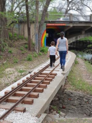 Tyren and Max following the railroad tracks