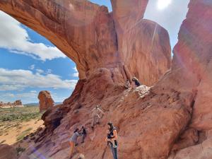 Grace makes a new friend at the Double Arch in Bryce Canyon