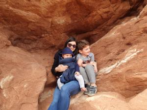 Tyren and the boys cuddle up while hiking in Bryce Canyon