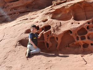 Junior Ranger Max investigates an interesting rock formation in Canyonlands
