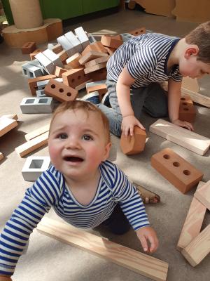 Mark and Max assist in rebuilding efforts at the site of what appears to be some sort of natural disaster