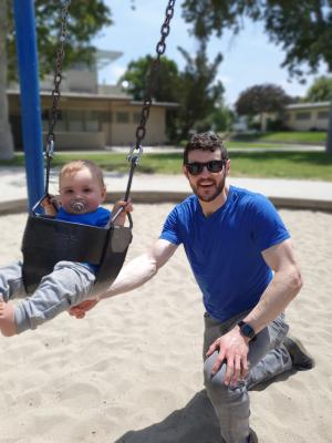 Paul pushing Mark on the swings. Max and Mark were REALLY loved these swings.