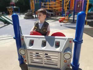 Max driving a truck in a local park