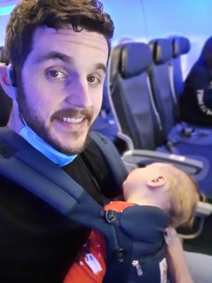 Mark sleeping on the redeye to New York