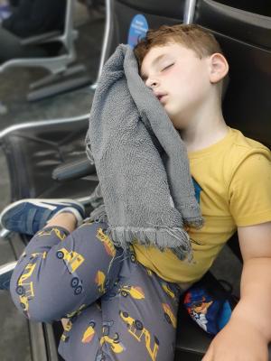 Max is already sleeping before we even made it on to the red eye flight