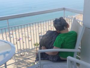 Max falls asleep on the porch while watching the beach
