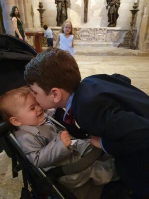 Max gives Mark a kiss at the ceremony