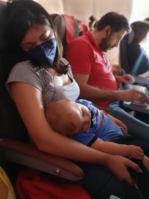 Mark and Tyren getting some much-needed rest on the flight home