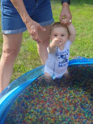 Mark in the pool, which Tyren had filled up with water beads