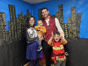 The family in costume at the Somerville Public Library Halloween event