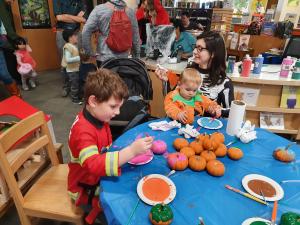 Painting pumpkins at the Somerville Public Library