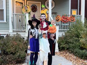 The family in costume on Halloween