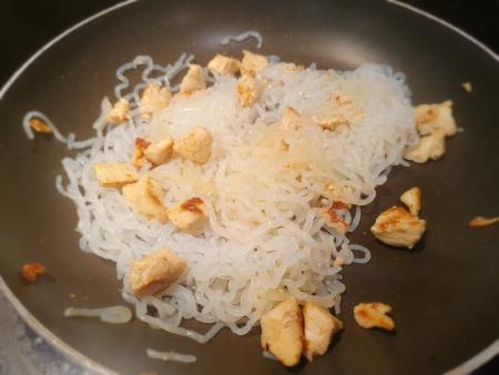 The noodles and chicken cooking, to dry out the noodles